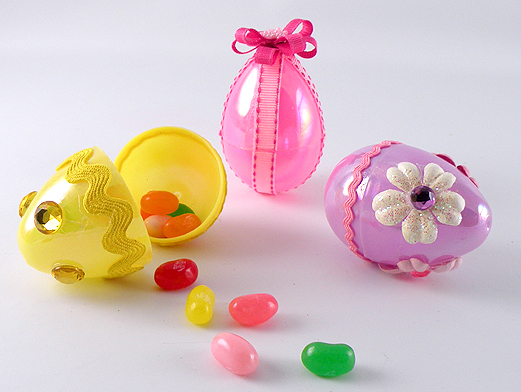 As most of you already know, I love to repurpose and make many of my crafts reusable like these decorated plastic eggs. I realize that plastic Easter eggs are already reusable but why not have more of a reason to want to keep them by making them pretty. The fun thing about these decorated plastic eggs is once they are filled with candy or a toy, they can accent a place settings at Easter dinner or be used in Easter baskets. They can also be given to friends, co-workers, or teachers as a sweet Easter gift. This is such an easy craft to make and is a lot of fun to do with the kids. I like to find small pieces of ribbon, fabric, beads, buttons, and anything else I have on-hand to decorated plastic eggs to create these little treasures.
