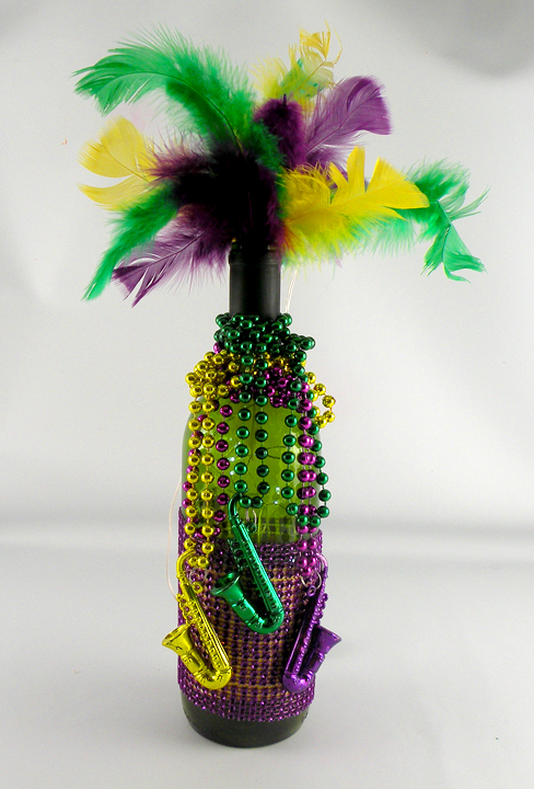 Decorated Mardi Gras bottles with feathers and beads