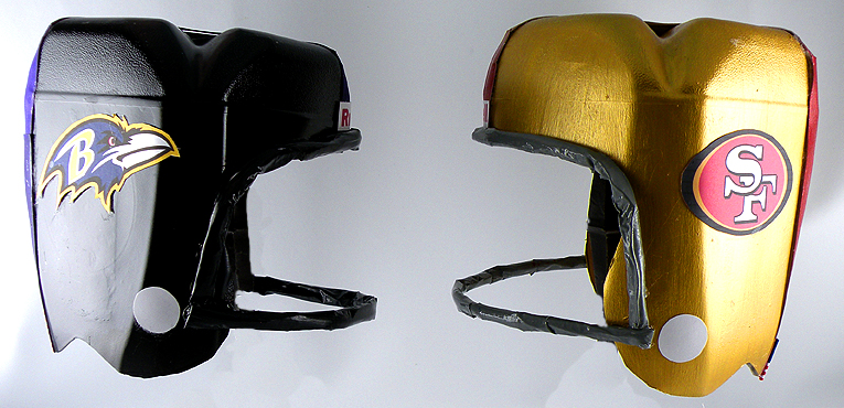 Black and Gold Milk Jug Football Helmets facing each other