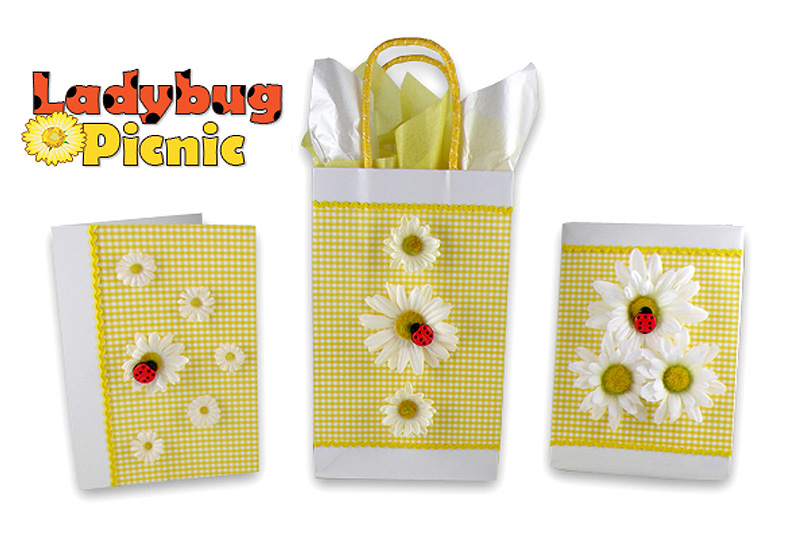Gift wrapped box, bag and card using yellow gingham, daisies and lady bugs
