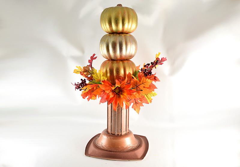 Three pumpkin topiary with metalic pumpkins and pedestal and autom flowers and leaves