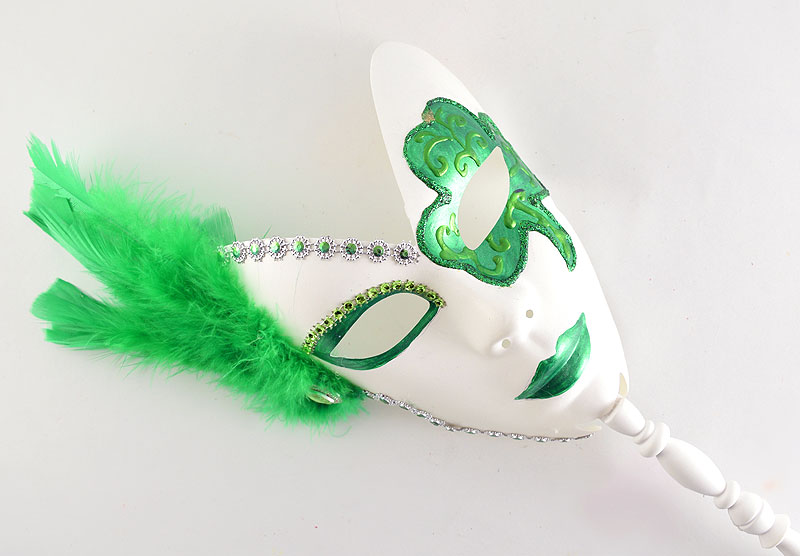 white mask with green accents and green feathers