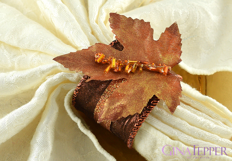 Bronze napkin ring accented with a copper leaf and beads