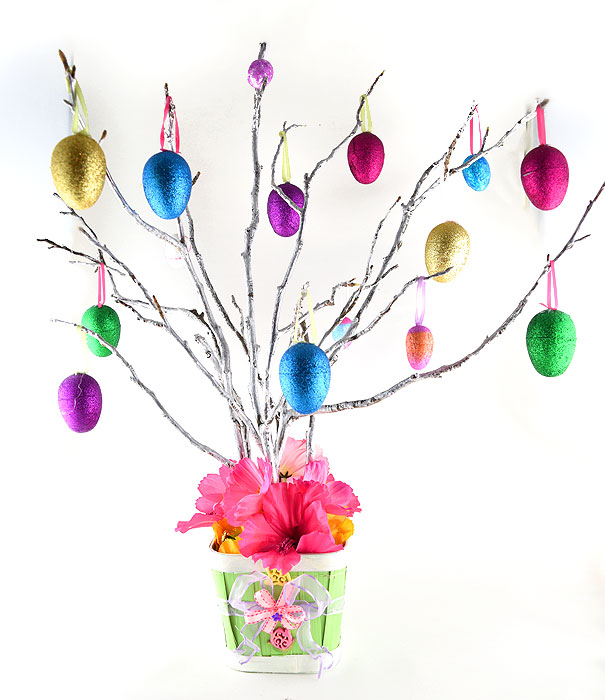 Silver branches with colorful glittery Easter eggs