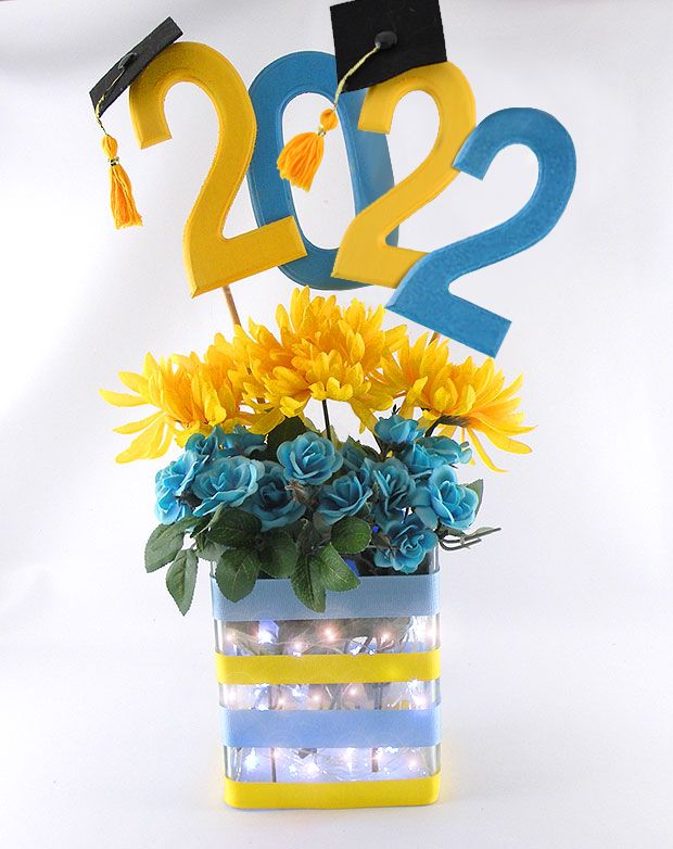 yellow and blue numbers 2022 in a vase with yellow in blue flowers
