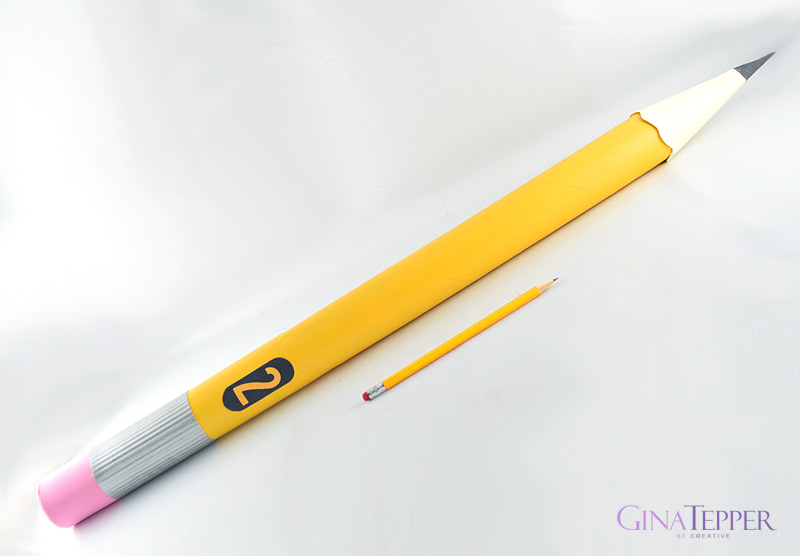 Giant Pencil prop next to a regular pencil