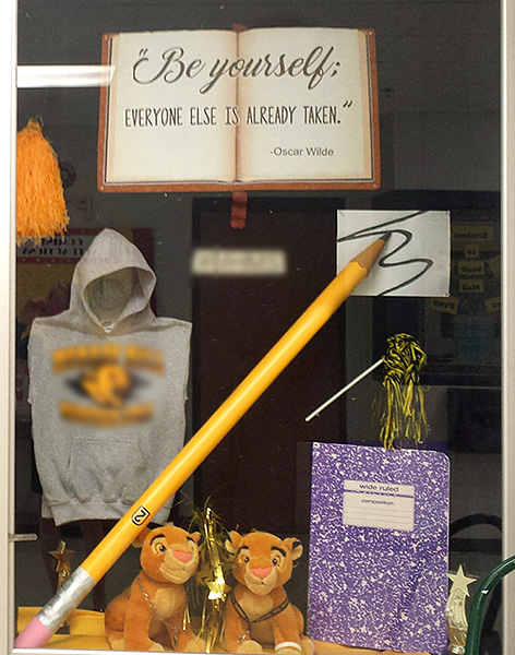 School bulletin board idea with giant pencil, book and composition book
