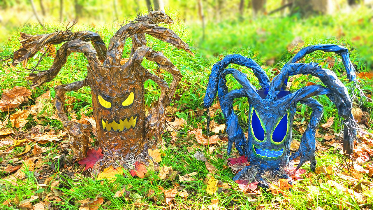 Two creepy Halloween trees. One is brown with glowing yellow eyes and a blue tree with glowing blue eyes and mouth.