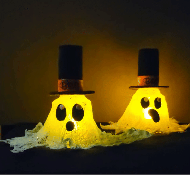Glowing cute small ghosts with dapper top hats, big eyes and a small cute mouth. They are made with a mesh cheesecloth.