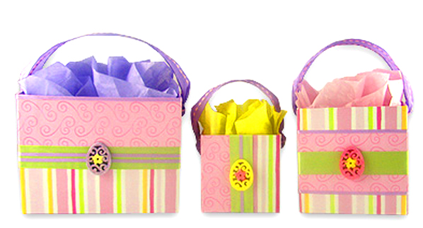 Handmade boutique-style Victorian gift boxes featuring floral ribbon, decorative egg embellishments, and custom pink and striped cardstock design.
