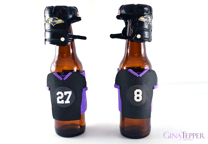 DIY Mini Football Helmets Sitting on the top of bottles