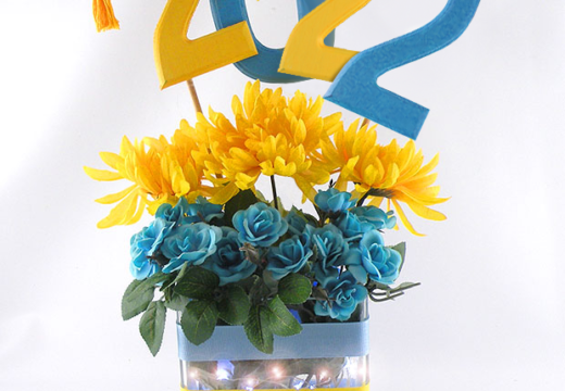 yellow and blue numbers 2022 in a vase with yellow in blue flowers