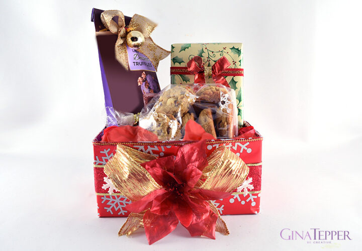 Christmas box decoratated with red wraping paper, snowflakes ribbon and filled with gifts