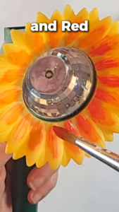 Painting the center of a sunflower onto a Dollar Tree solar light