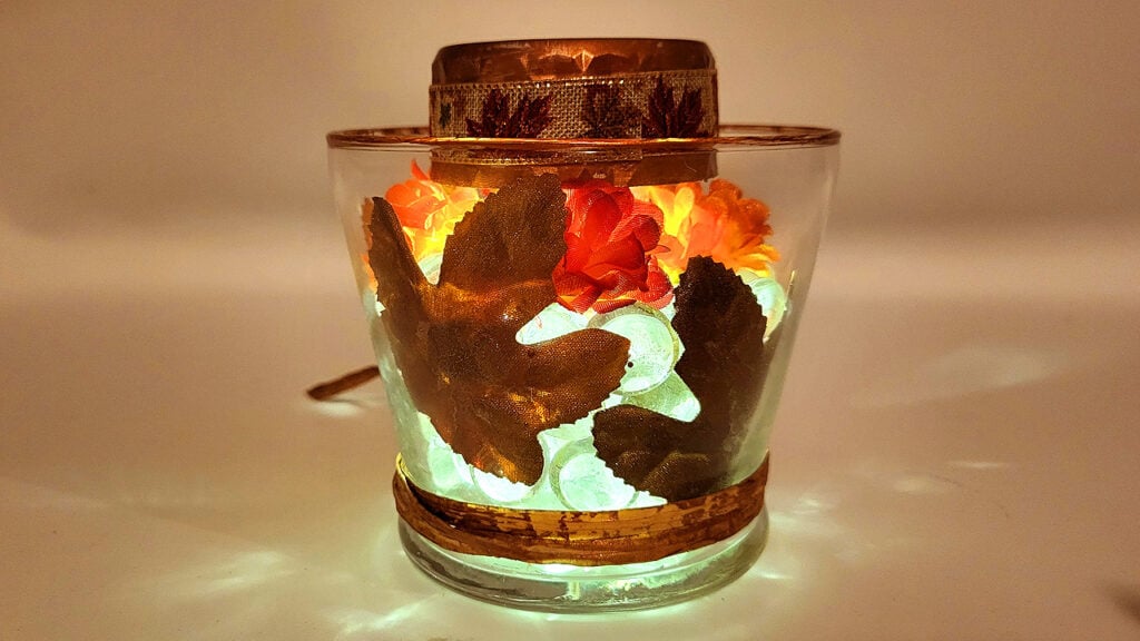Clear gem fall solar lantern glowing with autumn leaves inside