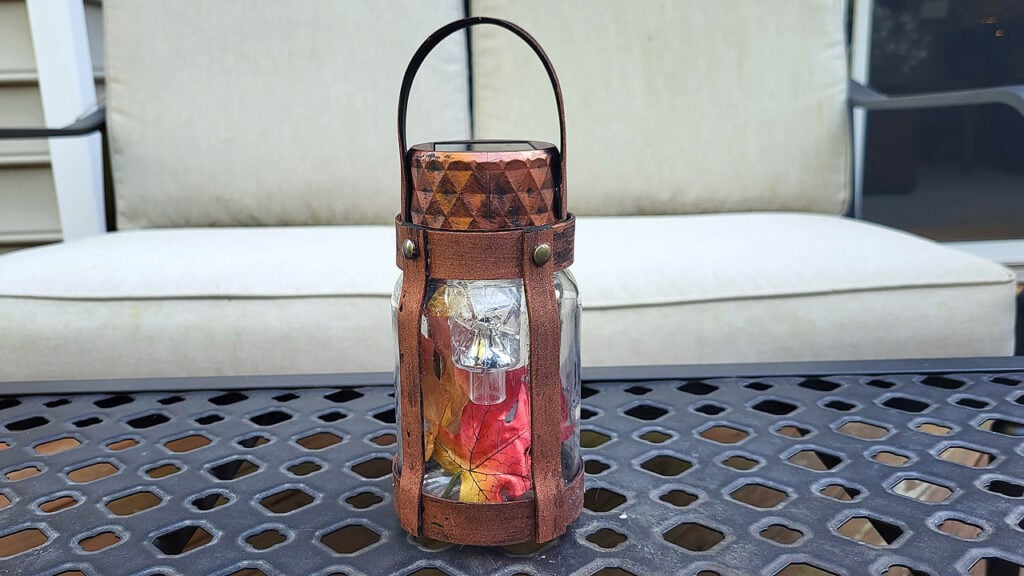 Industrial mason jar solar lantern made with Dollar Tree supplies and fall accents